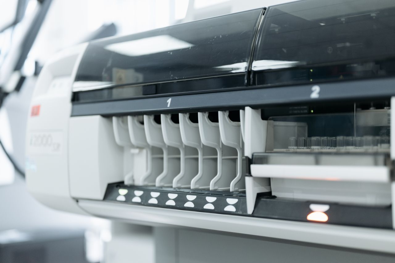 A close-up of advanced laboratory testing equipment used for medical and scientific research in a sterile environment.